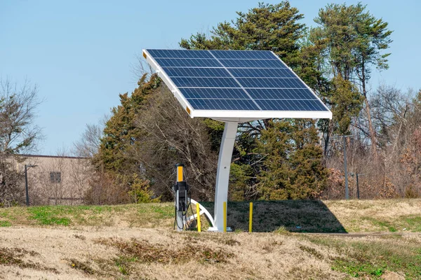 Horizontal shot of an electric vehicle charging station powered by solar energy.