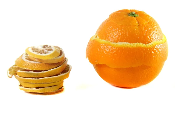 Peeling orange and sliced dried orange — Stock Photo, Image