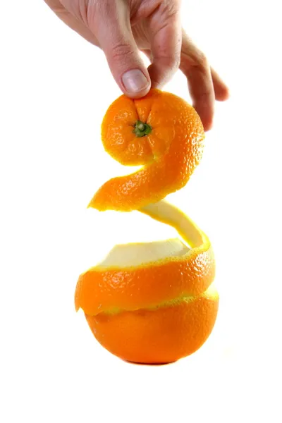 Hand holding peel of orange — Stock Photo, Image