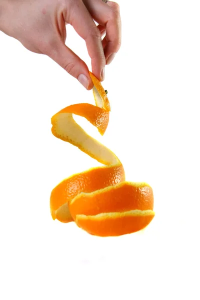 Hand holding peel of orange — Stock Photo, Image