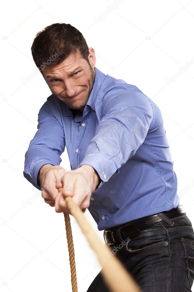 man pulling rope