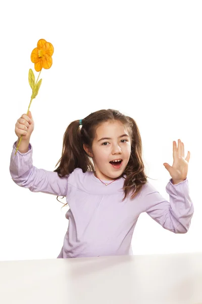 Little girl and artificial flower — Stock Photo, Image