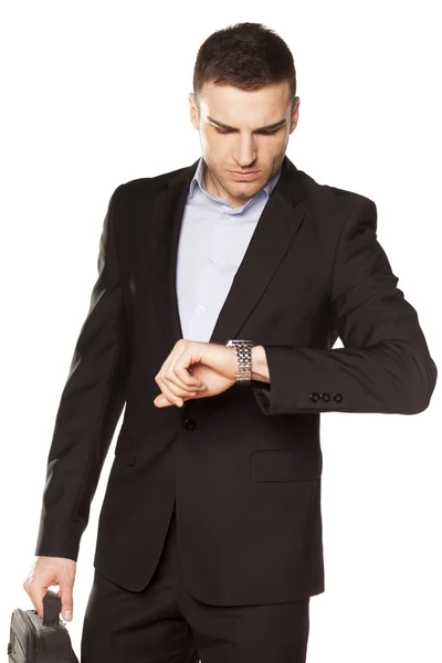 Businessman looking at his watch — Stock Photo, Image