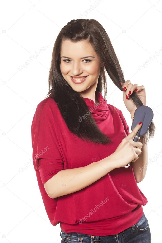 girl combs her hair