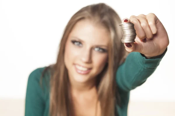 Girl holding coins — Stock Photo, Image