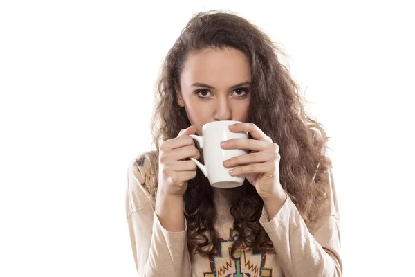 Girl drinking from a mug — Stock Photo, Image