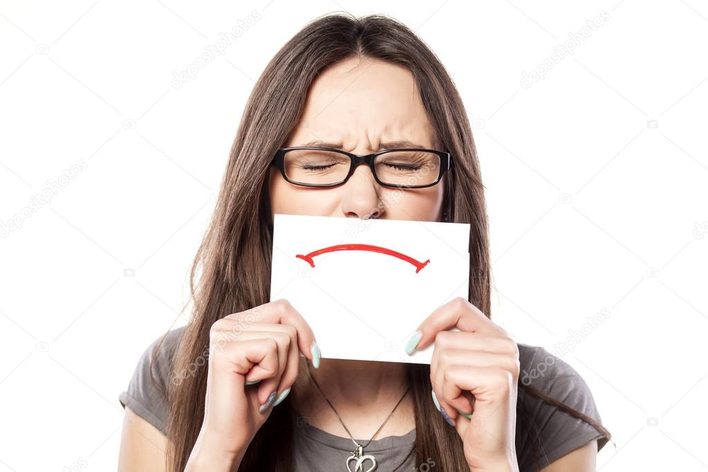 Sad smile on a paper