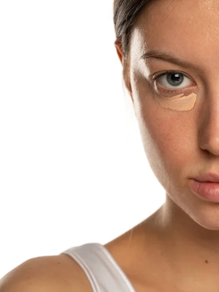 Closeup Young Woman Blue Eyes Concealer Her Eye White Background — Stock Photo, Image