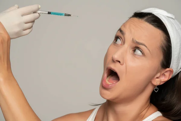 Portrait Young Scared Woman Face Filler Injection Procedure Gray Background — Stock Photo, Image