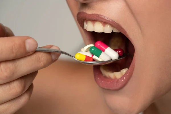 Young Woman Puts Spoonful Medicine Her Mouth — Stock Photo, Image