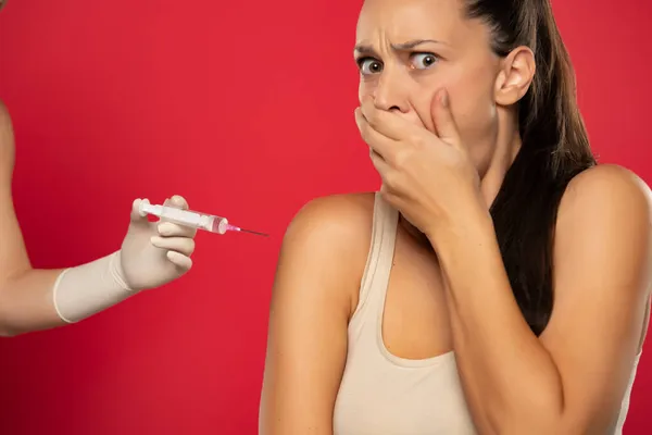 Young Woman Afraid Vaccinated Red Background — Stock Photo, Image