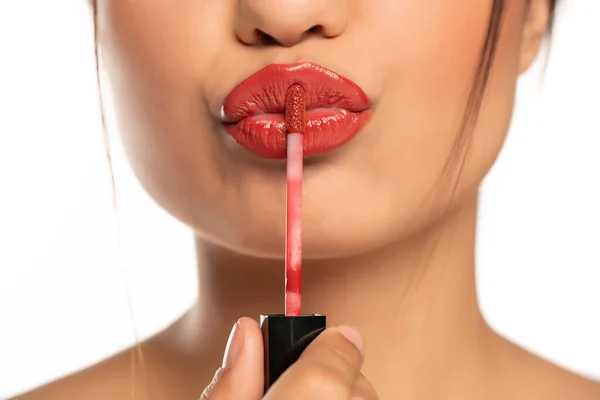 Close Young Beautiful Woman Applies Lip Gloss White Background — Stock Photo, Image