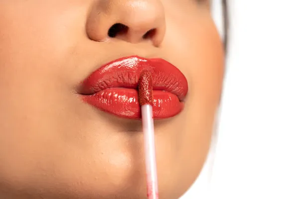 Closeup Young Beautiful Woman Applies Lip Gloss White Background — Stock Photo, Image