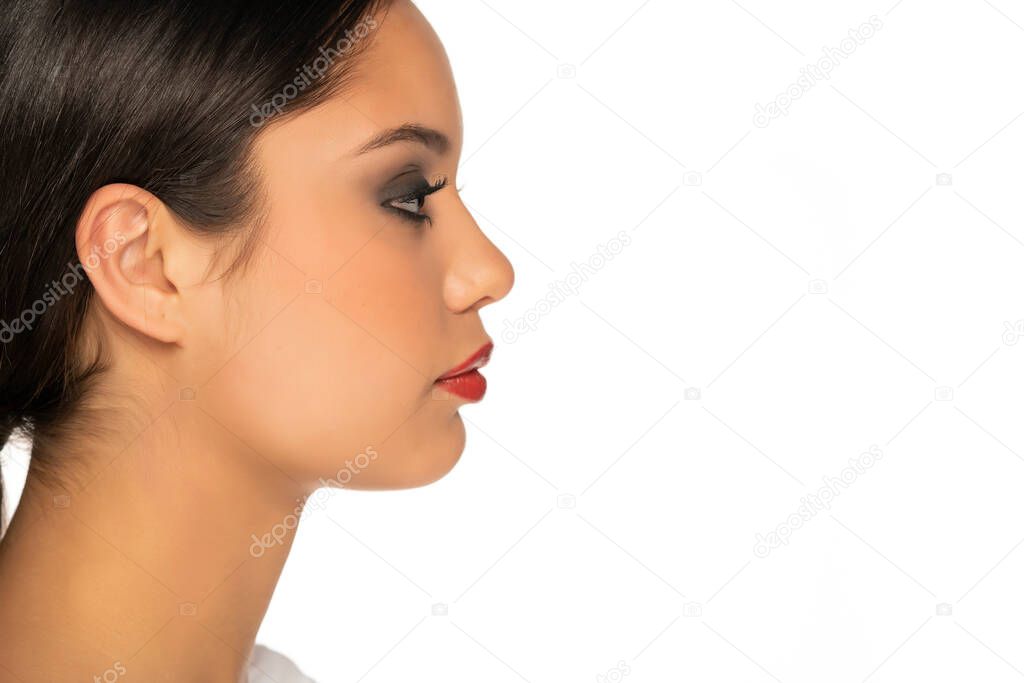 profile of a young beautiful woman on a white background