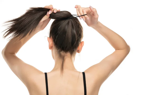 Rear View Young Woman Tying Her Long Hair White Background — Stock Photo, Image