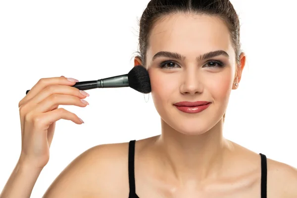 Portrait Smiling Teen Girl Applying Makeup Makeup Brush Her Face — Stock Photo, Image