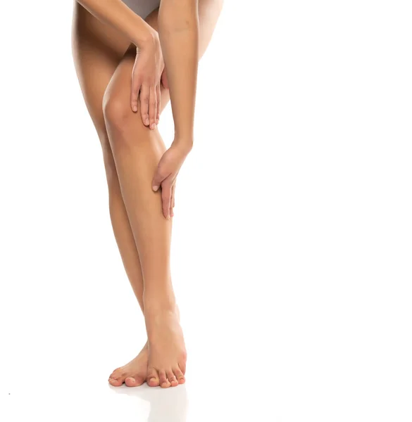 Woman Applying Skin Produst Her Legs White Background — Stock Photo, Image