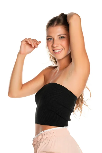 Молодая Счастливая Спортивная Женщина Черным Бессонным Верхом Белом Фоне — стоковое фото