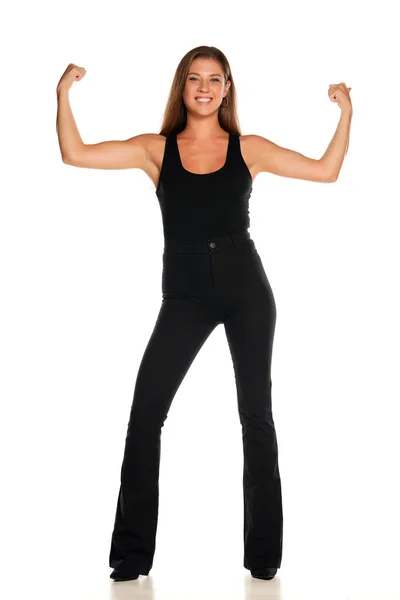 Young Beautiful Smiling Woman Black Shirt Trousers Showing Her Biceps — Stock Photo, Image