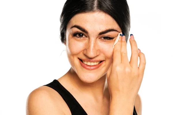 Happy Young Woman Removes Makeup Cotton Pad White Background — Stok Foto