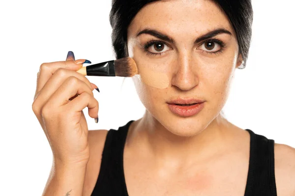 Young Freckled Woman Applying Liquid Foundation Makeup Brush White Background — Stock Photo, Image