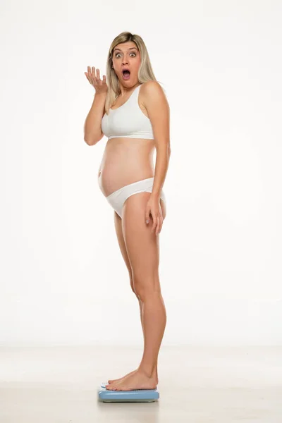 Young Shocked Pregnant Woman Standing Scale White Background — Stock Photo, Image