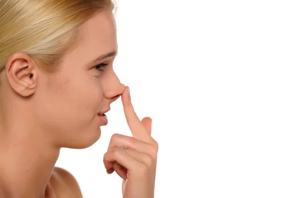 Young Blond Disapointed Woman Touches Her Nose Her Finger White — Stock Photo, Image
