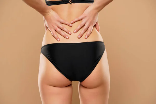 Woman Pain Waist Kidneys Beige Background — Stock Photo, Image