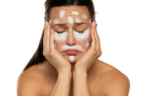 Unhappy Sad Woman Posing Face Cream White Background — Stock Photo, Image