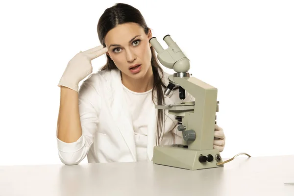 Unhappy Female Scientist Microscope Young Female Imitates Gun Shoot Makes — Stock Photo, Image