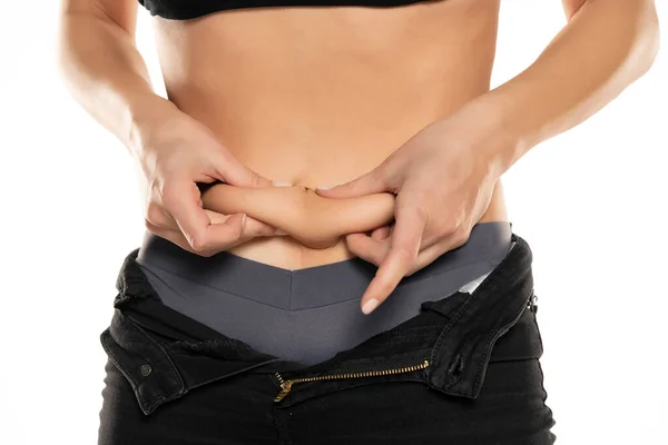 Closeup Young Fit Woman Pinching Her Belly White Background — Stock Photo, Image