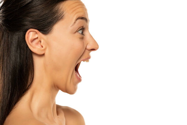 Profile of excited and happy woman on a white background.