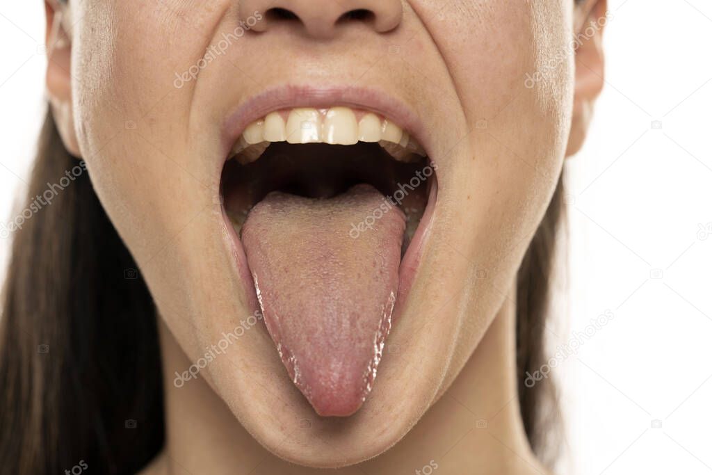 Close up of a front view of a woman tongue.