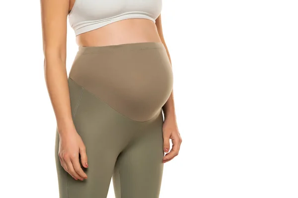 妊娠中の女性のための服 白い背景に隔離された高い腰とグレーのタイツ 妊娠の概念 — ストック写真