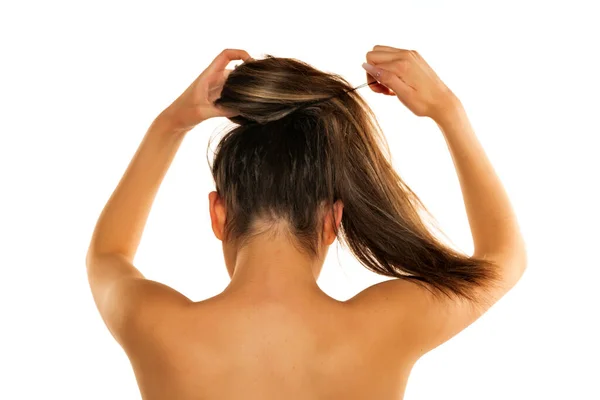 Rear View Young Woman Tying Her Long Hair White Background — Stock Photo, Image