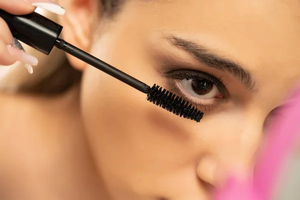 Close Woman Applying Mascara Lower Eyelashes White Background — Stock Photo, Image