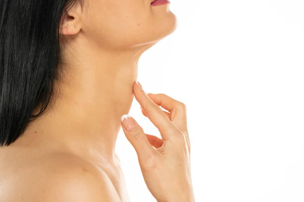 Closeup Woman Touches Her Neck White Background — Stok fotoğraf