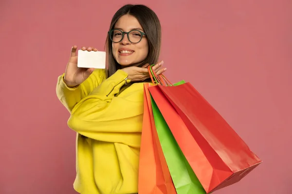 Close Happy Exited Brunette Woman Glasses Holding Credit Card Colorful — стоковое фото