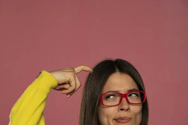 Half Portrait Young Woman Glasses Scratching Her Head Pink Background — 스톡 사진