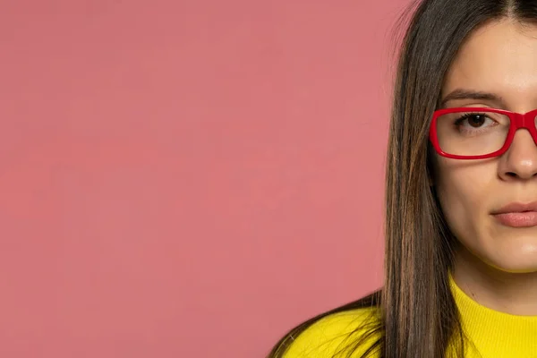 Half Portrait Young Serious Woman Yellow Blouse Red Glasses Pink — Stock Photo, Image