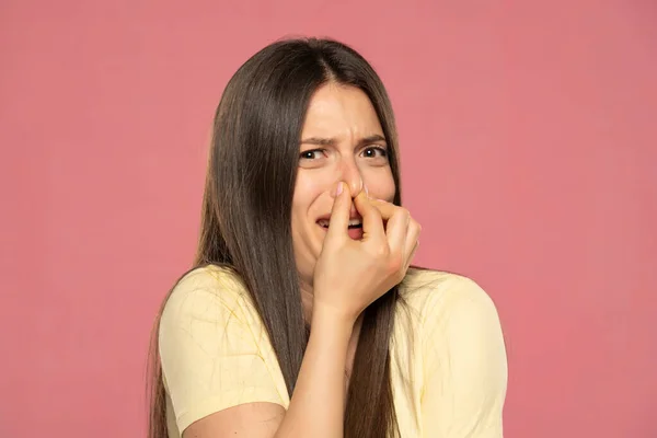 Portrait Frustrated Woman Pinching Nose Disgust His Face Due Bad — 스톡 사진