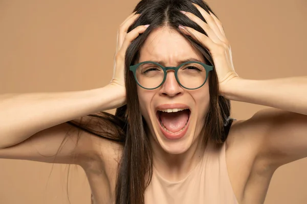 Closeup Portrait Stressed Frustrated Woman Eyeglasses Screaming Isolated Beige Background — 스톡 사진