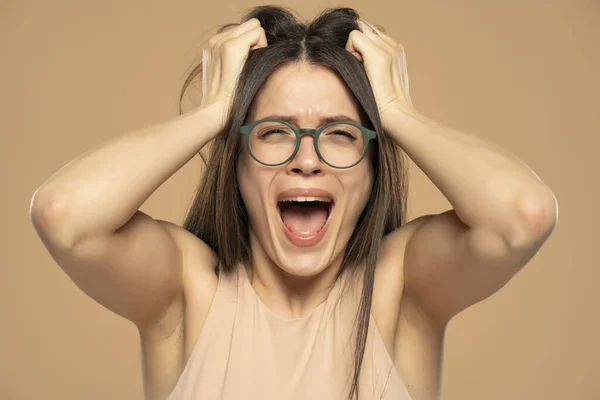 Closeup Portrait Stressed Frustrated Woman Glasses Screaming Isolated Beige Background — 스톡 사진