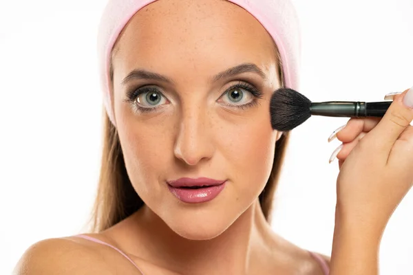 Young Woman Applying Dry Cosmetic Tonal Foundation White Background — Stok Foto