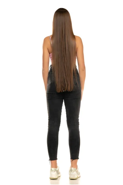 Full Length Rear View Young Woman Black Jeans Standing White — Stockfoto