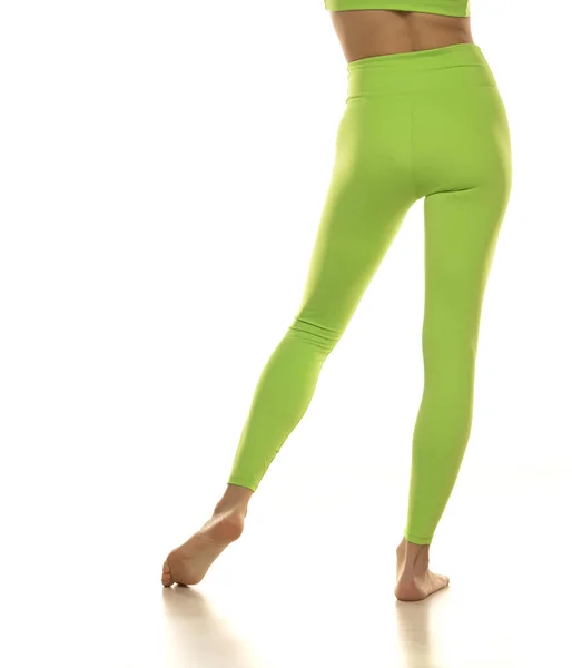 Sporty Green Leggings Slim Pretty Bare Legs White Background Rear — Stockfoto