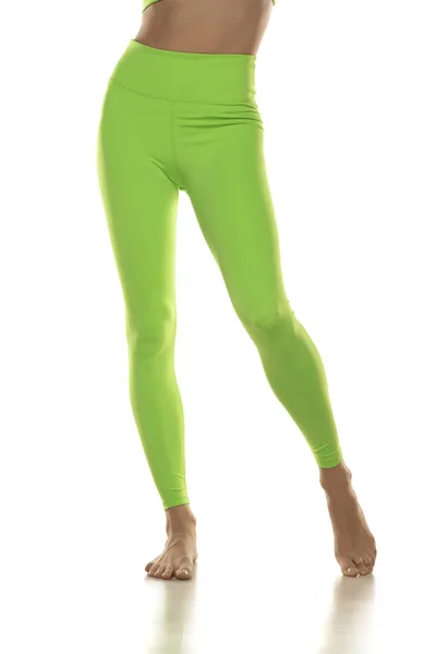 Sporty Green Leggings Slim Pretty Bare Legs White Background Front — Stockfoto