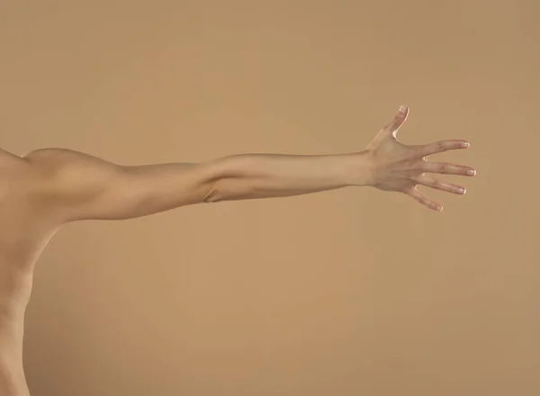 Young Woman Stretched Arm Palm Isolated Beige Background — 图库照片