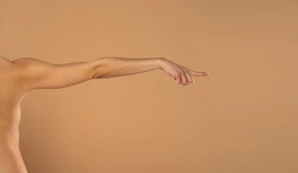 Young Woman Stretched Arm Touching Imaginary Product Index Finger Isolated — Φωτογραφία Αρχείου