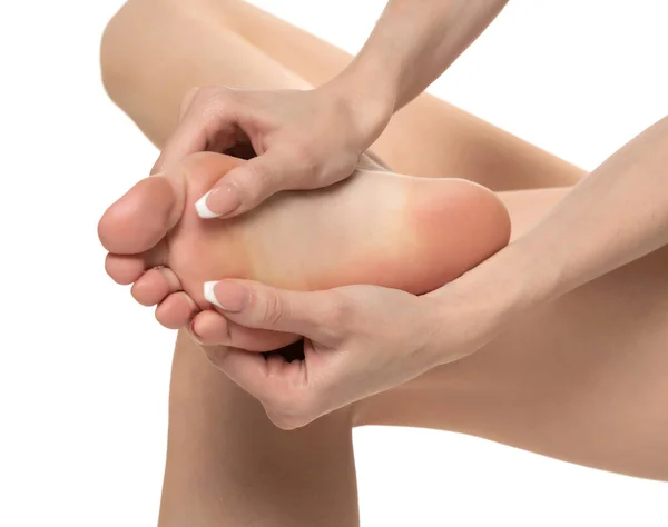 Woman Massaging Her Painful Foot White Studio Background — Zdjęcie stockowe